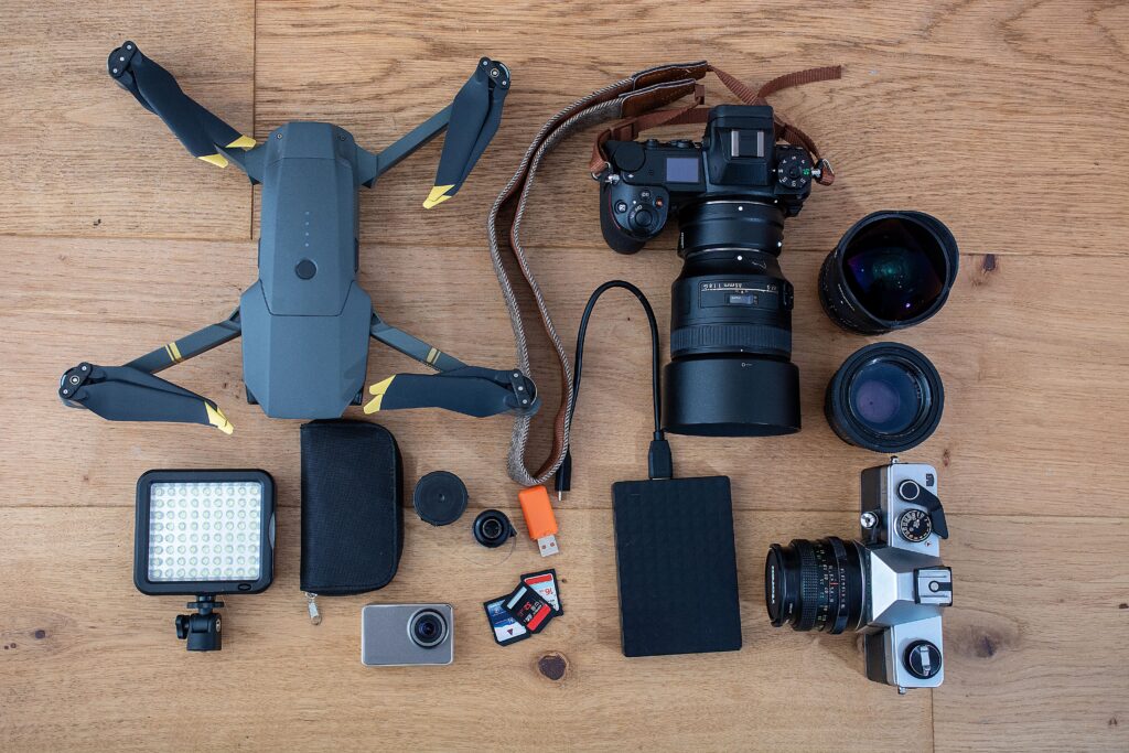 Assortment of photography equipment (camera, drone, sd cards, etc.)