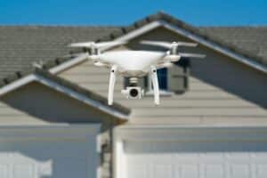 real estate drone in front of a property